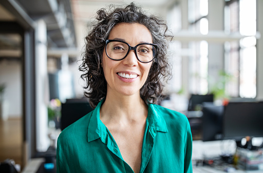 A smiling woman with dental crowns