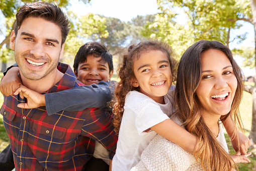 A smiling family that is happy about having perfect teeth