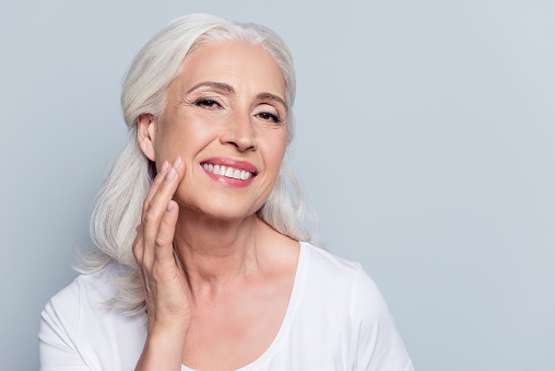 A smiling patient with ceramic veneers