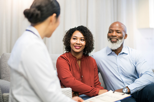 Patients meeting with dentist for a first visit consultation