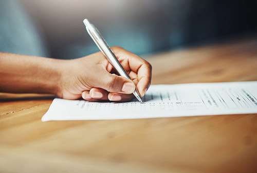 A patient completing forms